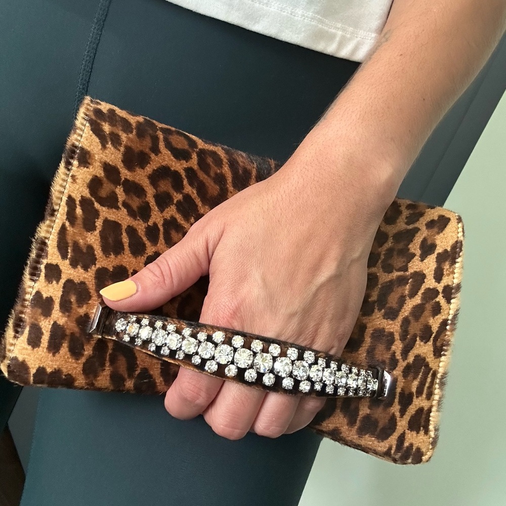 Jimmy Choo leopard printed clutch with jeweled handle.